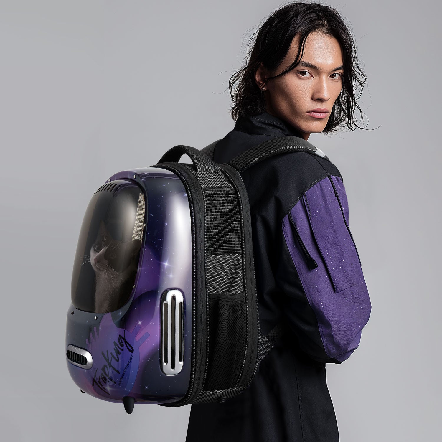 Breezy 2 Cat Carrier TrapKing Davis worn by a person with a cat inside, showcasing a good look design